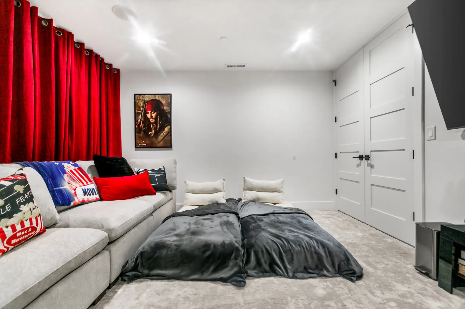 Cozy movie night bed setup in the home theater
